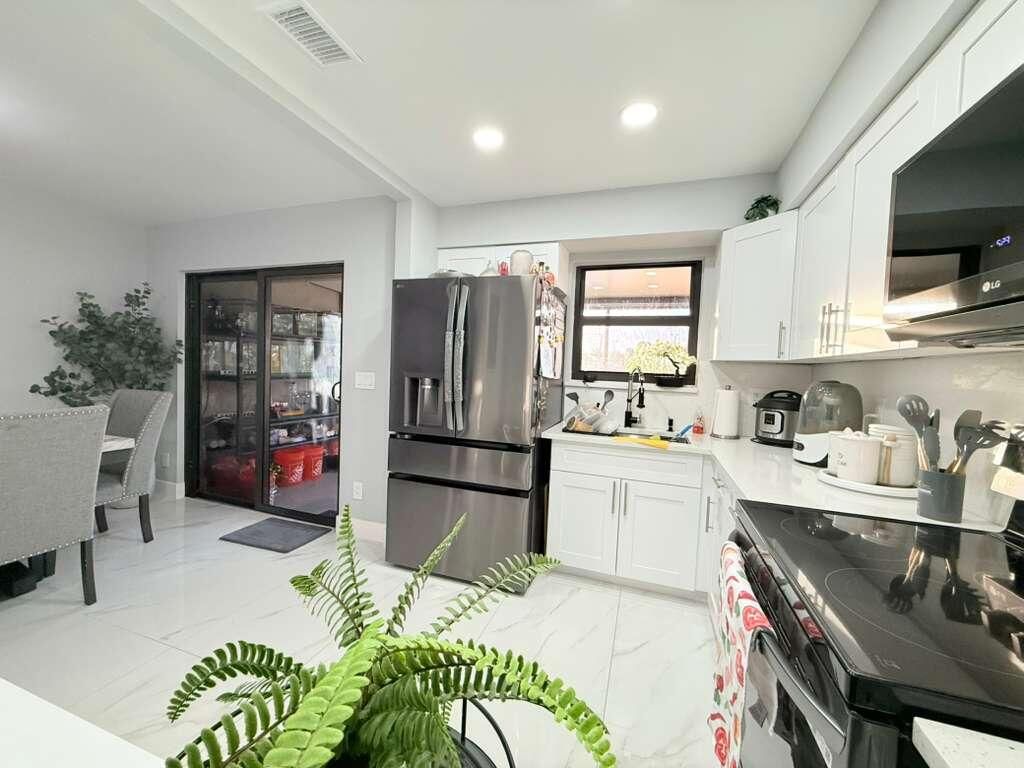 Photo of 2403 Seaside Drive, Greenacres, FL 33463 (MLS # R11160892)