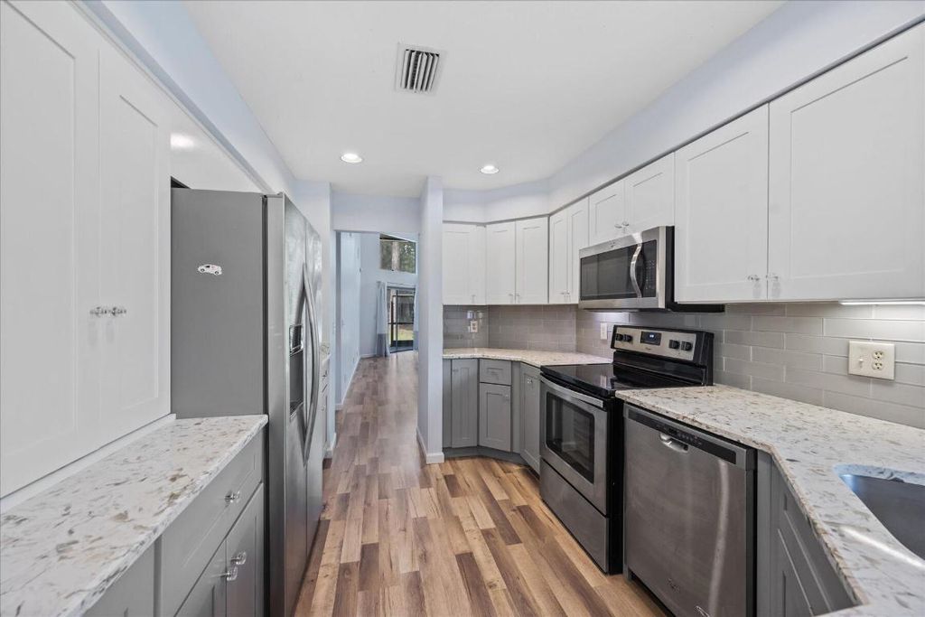 Photo of 1121 Sand Drift Way #B, West Palm Beach, FL 33411 (MLS # R11153453)