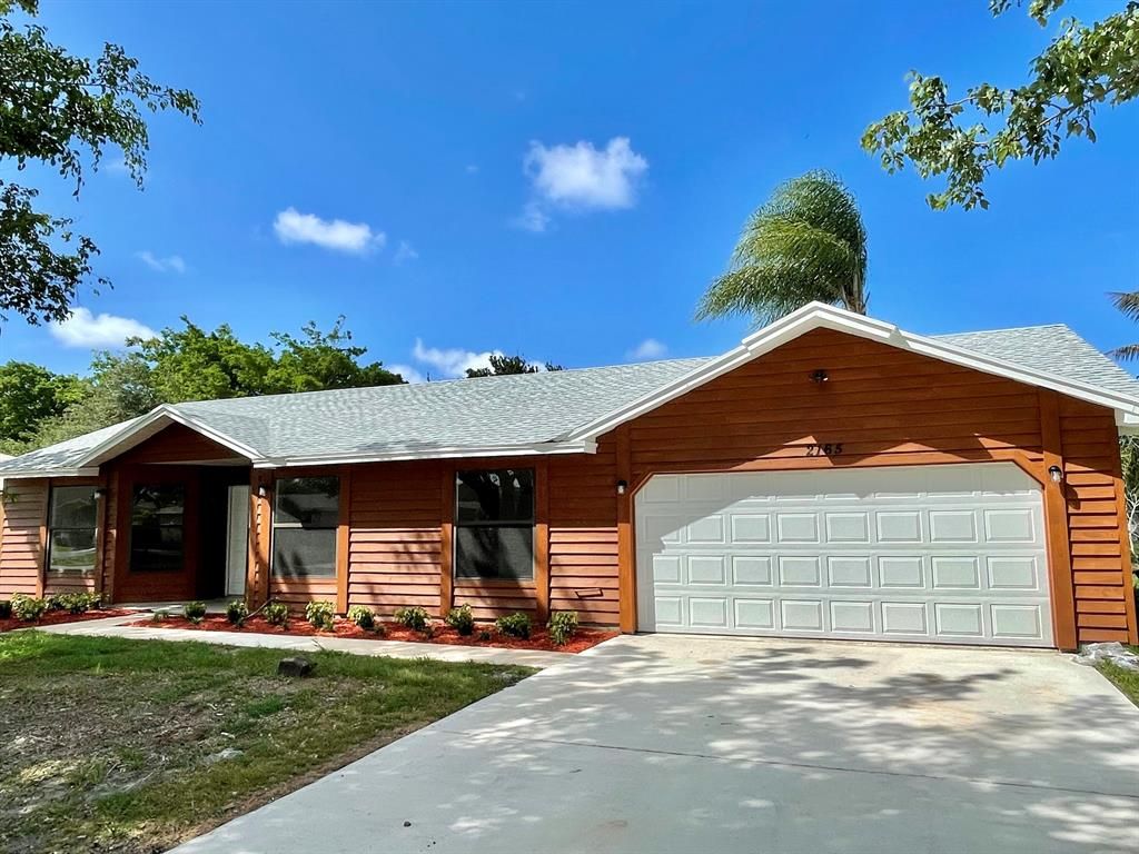 Photo of 2165 SE Gaslight Street, Port Saint Lucie, FL 34952 (MLS # R10729902)