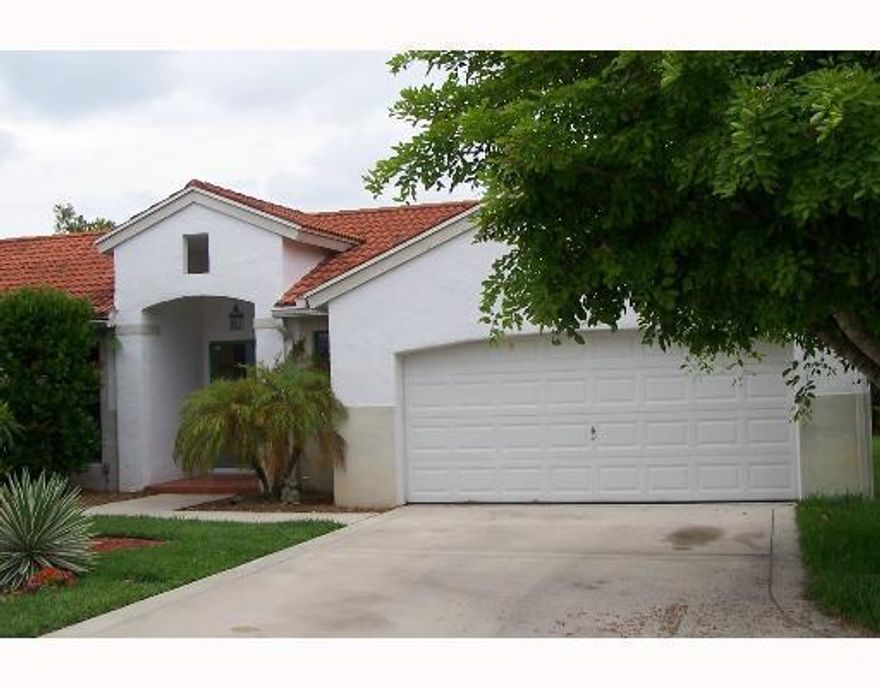 Great rental property in a culdesa in Wellington Lakes walking distance from the community pool and tot lot. Spacious family area with 3 bedrooms and 2 bathrooms. Nice porch with a canal view. Kitchen has wood cabinets with granite counter tops