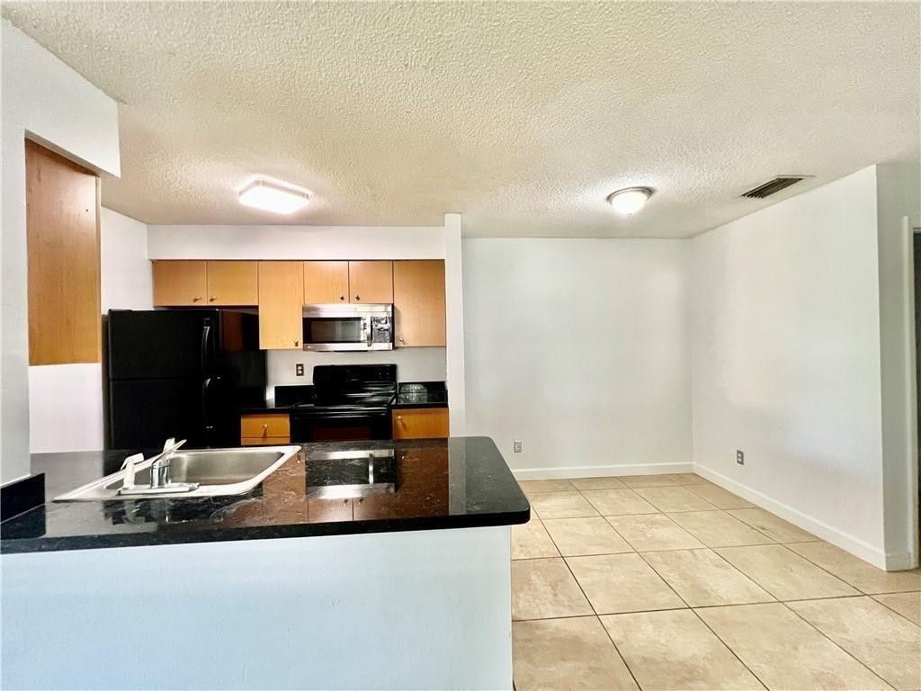Photo of 741 NW 104th Avenue #203, Hollywood, FL 33026 (MLS # F10548828)