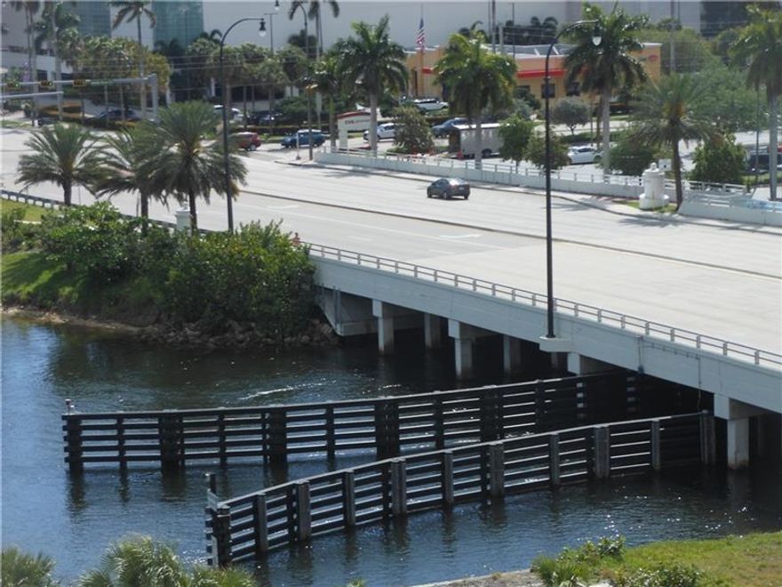 First Class waterfront building!  Spacious 1 bedroom 1.5 baths, 1138 sq. ft with impact windows and doors. Washer/dryer, updated kitchen and baths, bedroom has a large walk-in closet 
with built ins and electric black out shades. Plantation shutters and a built-in Murphy bed in living room.  Large south side balcony with amazing views of downtown, Middle River and the Galleria 
Mall. Covered garage parking with plenty of guest spaces and 24-hour security.  Walk to Parks, Beaches, shopping and restaurants.  Resort lifestyle living includes heated pool, boat docks, clubhouse and BBQ area in a tropical setting.