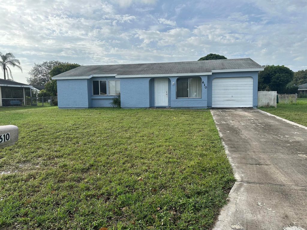 Photo of 610 SW Old Briar Avenue, Port Saint Lucie, FL 34953 (MLS # R10950327)