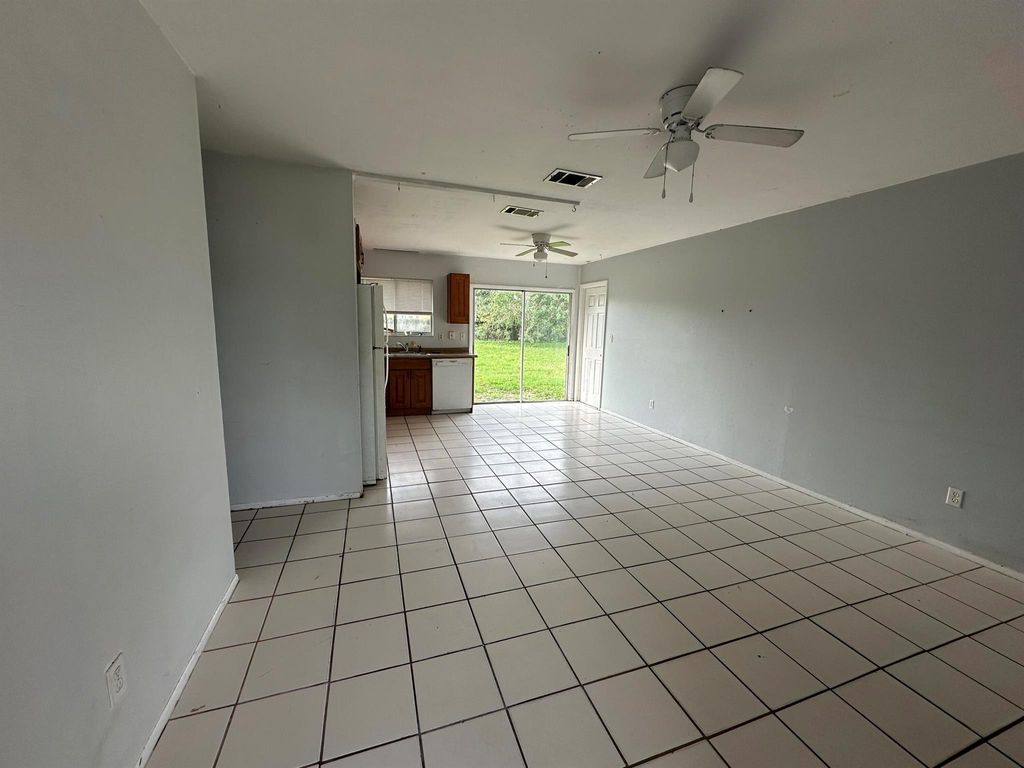 Photo of 610 SW Old Briar Avenue, Port Saint Lucie, FL 34953 (MLS # R10950327)