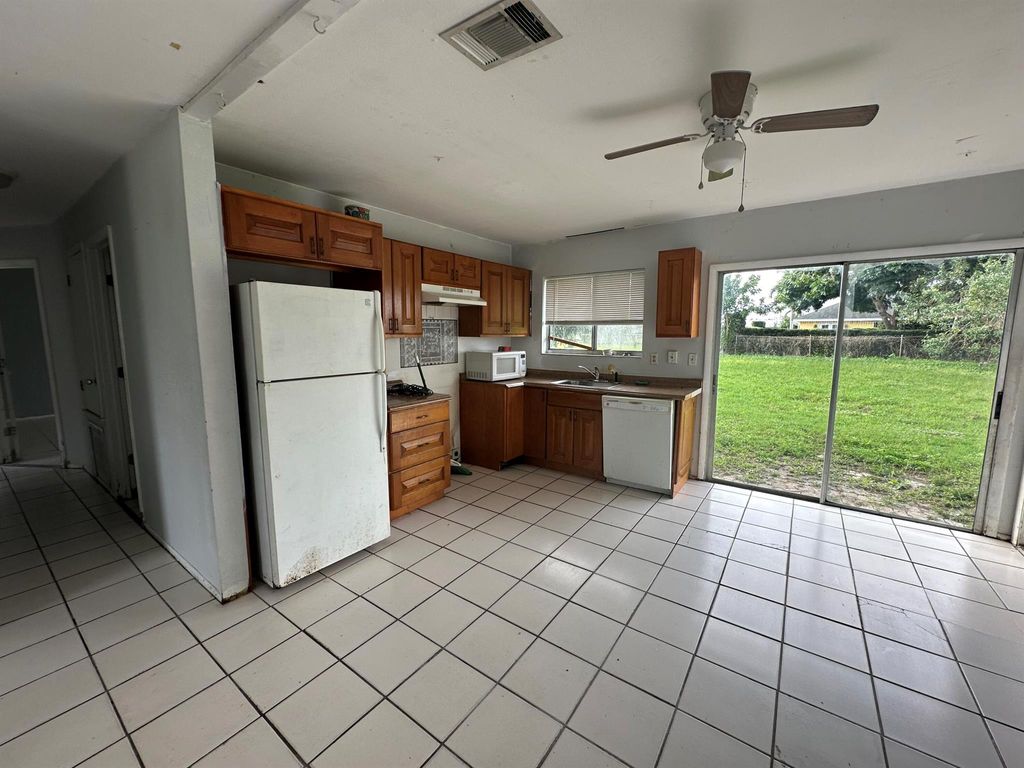 Photo of 610 SW Old Briar Avenue, Port Saint Lucie, FL 34953 (MLS # R10950327)