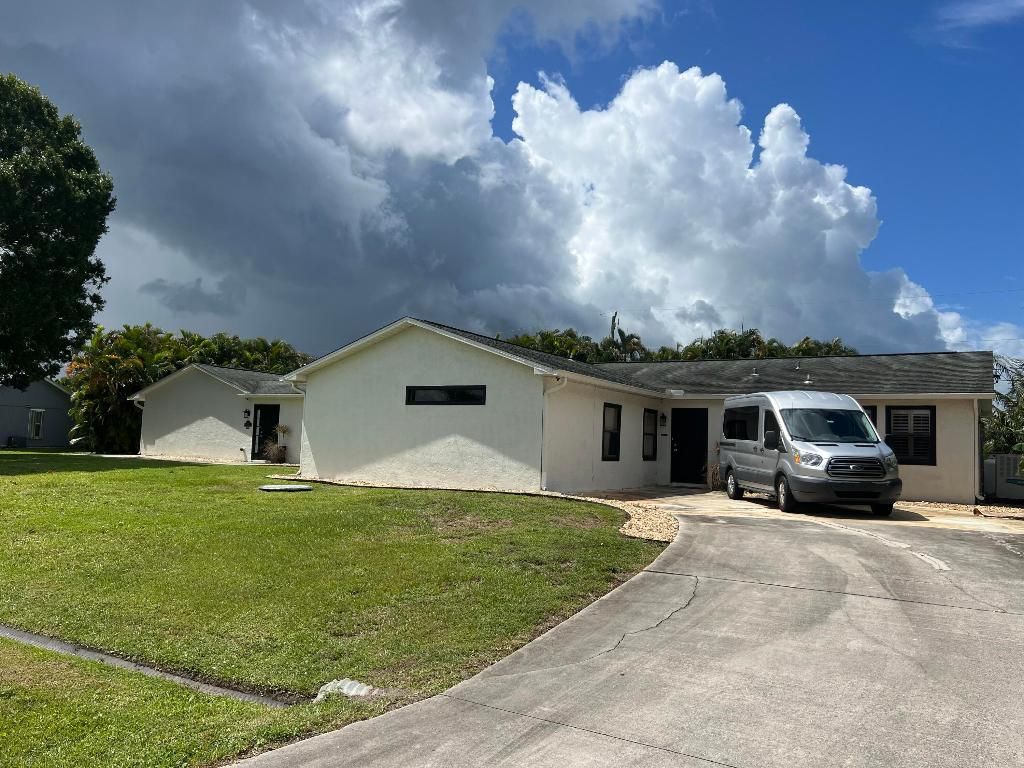 Photo of 1290 SW Fletcher Lane, Port Saint Lucie, FL 34953 (MLS # R11103646)