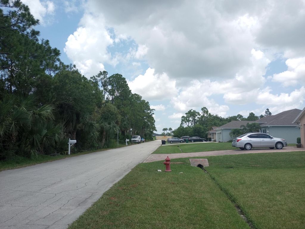 Photo of 1661 SW Salvatierra Boulevard, Port Saint Lucie, FL 34987 (MLS # R11014856)