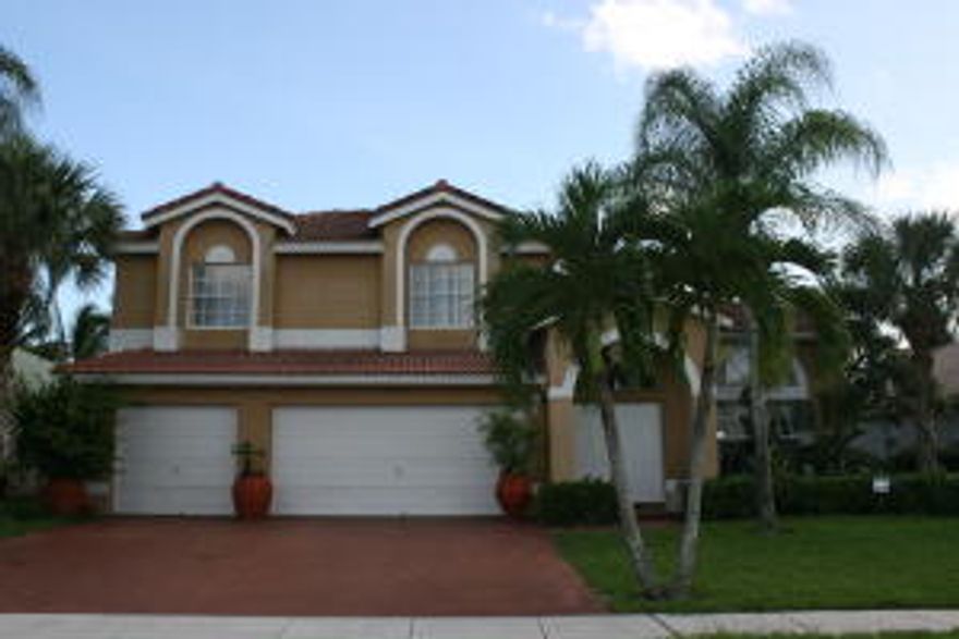 BEAUTIFULLY FURNISHED LAKEFRONT HOME LOCATED ON A CUL-DE-SAC.  5 BEDROOM 3 FULL BATH WITH 3 CAR GARAGE, MASTER SUITE LOCATED ON GROUND LEVEL AS WELL AS A GUEST ROOM/OFFICE AND 3 LARGE BEDROOMS UPSTAIRS.  COMFORTABLE FAMILY ROOM OPENS TO UPDATED KITCHEN WITH GRANITE COUNTER TOP AND CHERRY WOOD CABINETS, BOTH WITH RELAXING LAKE VIEWS. LARGE LIVING ROOM, TILE & WOOD FLOORS THROUGHOUT, EXTRA LARGE SCREENED PATIO WITH SUMMER KITCHEN & BAR-B-QUE OVERLOOKING MANICURED YARD, FOUNTAIN AND LAKE. UP TO TWO PETS ALLOWED. THE PROPERTY IS LOCATED JUST MINUTES FROM WEF AND THE INTERNATIONAL POLO CLUB AS WELL AS A QUICK RIDE TO THE JIM BRANDON EQUESTRIAN CENTER. COMMUNITY HEATED SWIMMING POOL, FITNESS CENTER, A LIT BASKETBALL COURT, 2 TENNIS COURTS, KIDS TOT-LOT AND A HASSLE FREE ASSOCIATION APPROVAL.