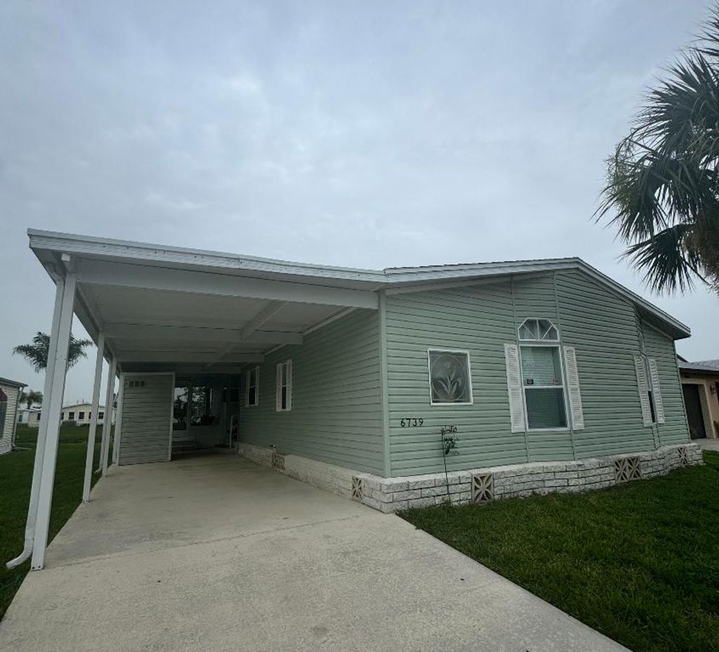 Photo of 6739 Yedra Avenue, Fort Pierce, FL 34951 (MLS # R11096877)