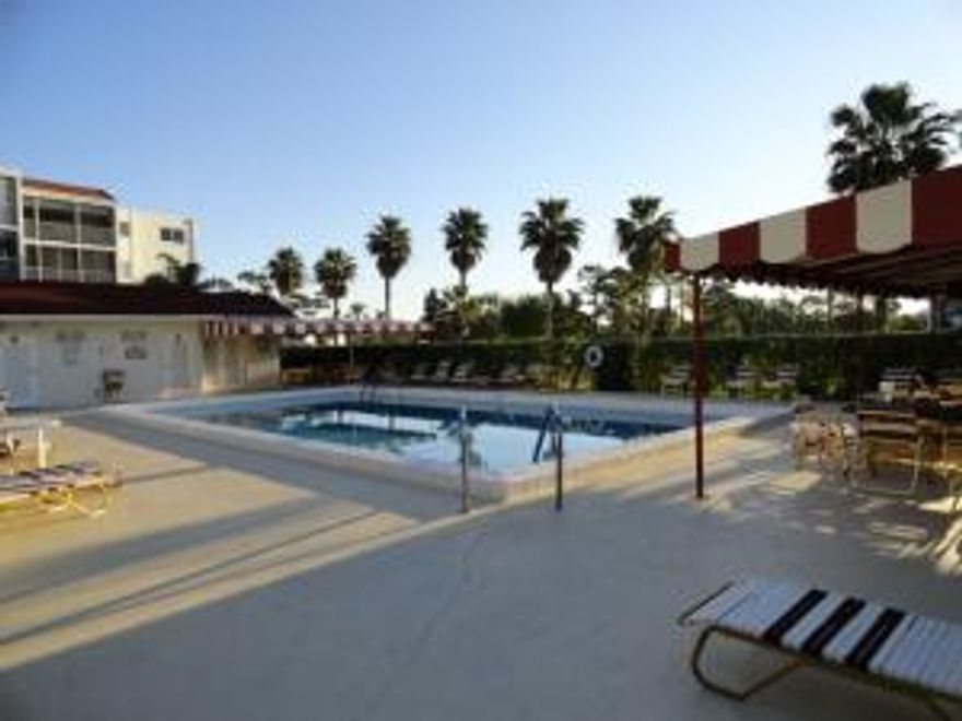 IMMACULATE, FRESHLY PAINTED, NICE UPGRADES!! THIS CONDO IS READY FOR YOU!
LARGE DIAGONALLY LAID MATCHING TILE THROUGHOUT, 2011 AC, NEWER APPLIANCES (EXCEPT FOR  STOVE), NEWER WINDOW TREATMENTS,& IMPACT GLASS WINDOWS THROUGHOUT. THE TILED BALCONY HAS EXTERIOR SLIDERS WHICH KEEP OUT THE RAIN AND KEEP IN THE BEAUTIFUL POOL & GOLF VIEWS. THIS BALCONY ALSO HAS MIAMI-DADE RATED ACCORDION SHUTTERS MAKING THE ENTIRE CONDO PROTECTED. THE ESSEX BUILDING HAS ITS OWN POOL & IS BEAUTIFULLY LANDSCAPED. POINCIANA'S CLUBHOUSE GIVES YOU ANOTHER REASON TO BUY THIS FURNISHED CONDO (UNFURNISHED IF DESIRED). THE NO EQUITY CLUBHOUSE HAS TENNIS, PAY-AS-YOU-PLAY GOLF, CAFE, WI-FI, MOVIES, SHOWS IN SEASON, TRIPS, CLASSES, LIBRARY, BILLIARDS, EXERCISE ROOM, LECTURES AND MORE!! DON'T WAIT ON THIS ONE!