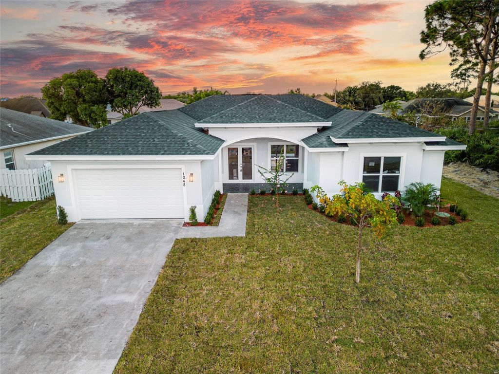 Photo of 1048 SW Paar Drive, Port Saint Lucie, FL 34953 (MLS # F10401919)