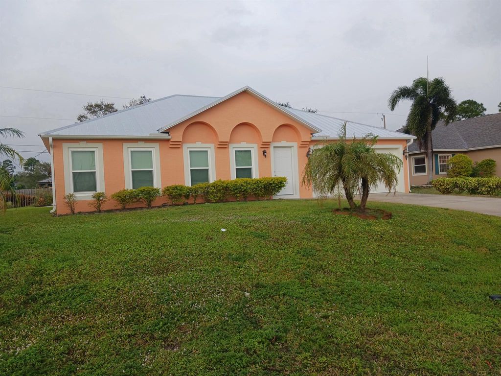 Photo of 124 SW Sea Lion Road, Port Saint Lucie, FL 34953 (MLS # R11043365)