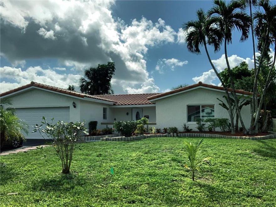 Gorgeous 4 bedroom/2 bathroom single family home in beautiful Coral Springs. This home has a BRAND NEW TILE ROOF!!! This home is COMPLETELY RENOVATED, and boasts a 2-car garage, with a brand new impact garage door that has remote control. This amazing home is move-in ready, and comes with a brand new island kitchen, brand new stainless appliances, brand new and remodeled bathrooms, brand new floors, completely rehabbed pool, 2019 AC unit, and many more lovely features. Also, no HOA fees!!!