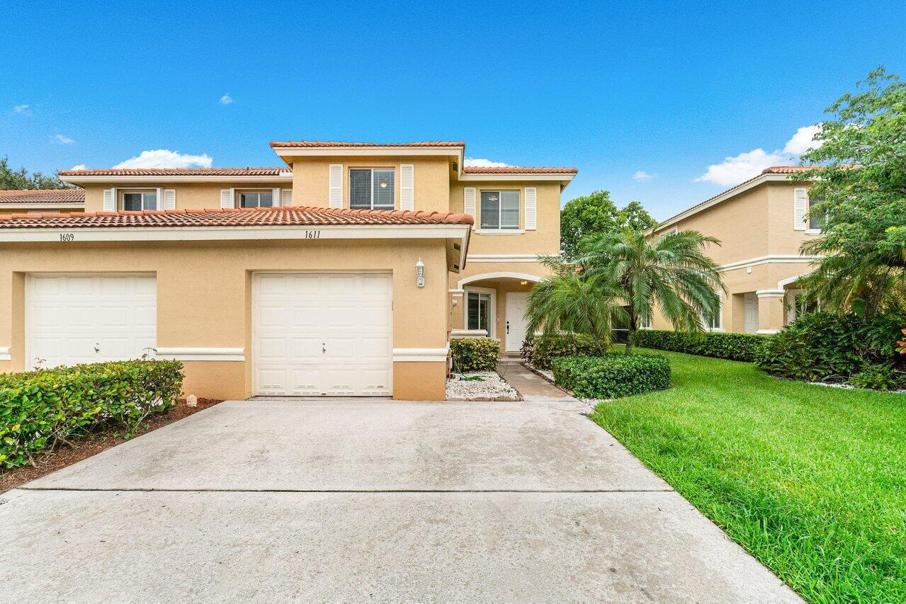 Two-story townhouse in the heart of Boynton Beach. Located in a secluded gated community, this 3-bedroom 2.1 bath town house features a welcoming kitchen, extensive living room, stainless-steel appliances, one car garage plus a two-car driveway. This home is bright and airy with additional windows as it is an end unit plus has been updated durable flooring on the first and second floor, a primary bedroom with a generous walk-in closet. Other bonus features are an extended bedroom 2 with two grab closets, a desirable screened patio, and an abundance of storage. Retreat to the community pool just a short walk away and playground around the corner.