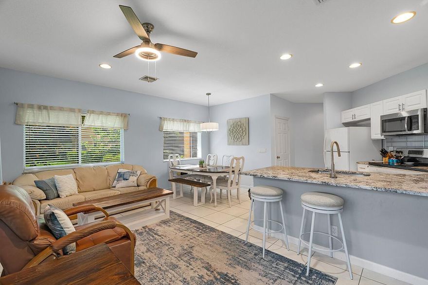 IMMEDIATE INCOME POTENTIAL! Incredible opportunity to own a fully furnished & stocked, move-in ready, 2 Bed/ 2.5 Bath, ground-floor condo, in the gated Castle Pines at PGA Village. This turnkey corner unit is ideal as an Airbnb, Investment Property, Winter Retreat or Primary Residence with rental potential. The condo is laid out as two separate living suites, each with its own entrance. Side B is a studio with kitchenette, full bathroom, patio and is currently leased through June for $1,200/month. Sida A has 1 bed/1.5 bath, updated kitchen, spacious open concept and screened patio. Side A is ready for you to Airbnb, lease out or occupy. With a resort-style pool & hot tub, ideal location and flexibility of long or short-term rentals, this deal is not to be missed!