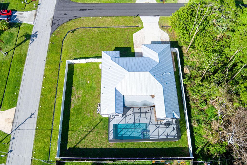 Photo of 1199 SE Puritan Lane, Port Saint Lucie, FL 34983 (MLS # B26012488)