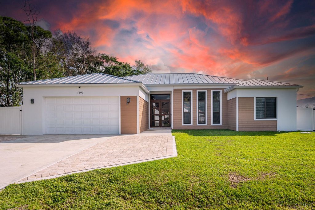 Photo of 1199 SE Puritan Lane, Port Saint Lucie, FL 34983 (MLS # B26012488)