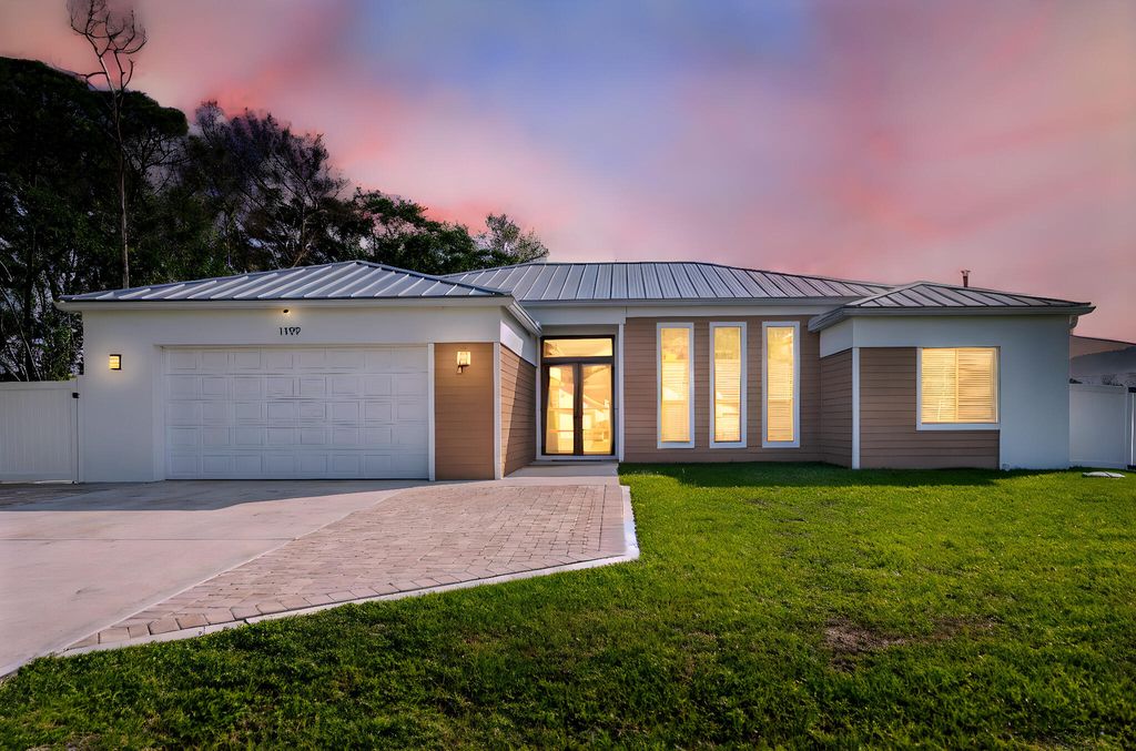 Photo of 1199 SE Puritan Lane, Port Saint Lucie, FL 34983 (MLS # B26012488)