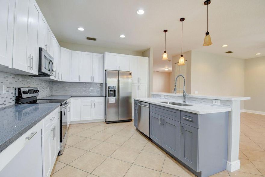 Fully renovated home. With 5 bedrooms and 3 full baths. This grand home features new gray and white designer kitchen with quartz counters and stainless steel appliances. One bedroom and full bath on first floor. 4 bedrooms and 2 full baths upstairs. Full laundry room. Matching vanities in each bathroom and new wood like laminate flooring throughout. Large walk-in closets and very spacious bedrooms throughout.Currently occupied so pictures does not show furniture. This upgraded home in the family community of Canyon Springs with Clubhouse, pool and lots of green space.