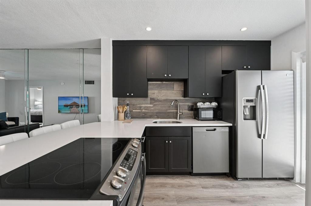 Photo of 1461 S Ocean Boulevard #204, Pompano Beach, FL 33062 (MLS # B26094517)