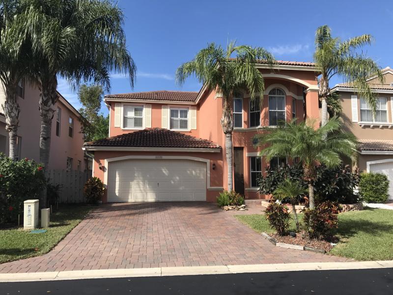 Perfectly maintained home in beautiful community of Cocoplum. Great open floor plan with beautiful granite counter tops. Master upstairs with one bedroom downstairs. Lovely patio area for outdoor living.