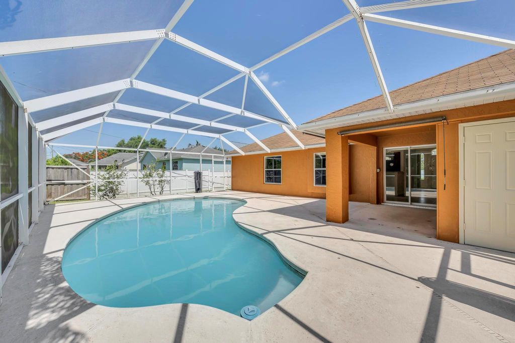 Photo of 5075 NW Egret Avenue, Port Saint Lucie, FL 34983 (MLS # R10991238)