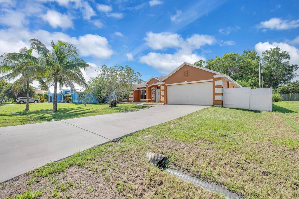 Photo of 5075 NW Egret Avenue, Port Saint Lucie, FL 34983 (MLS # R10991238)