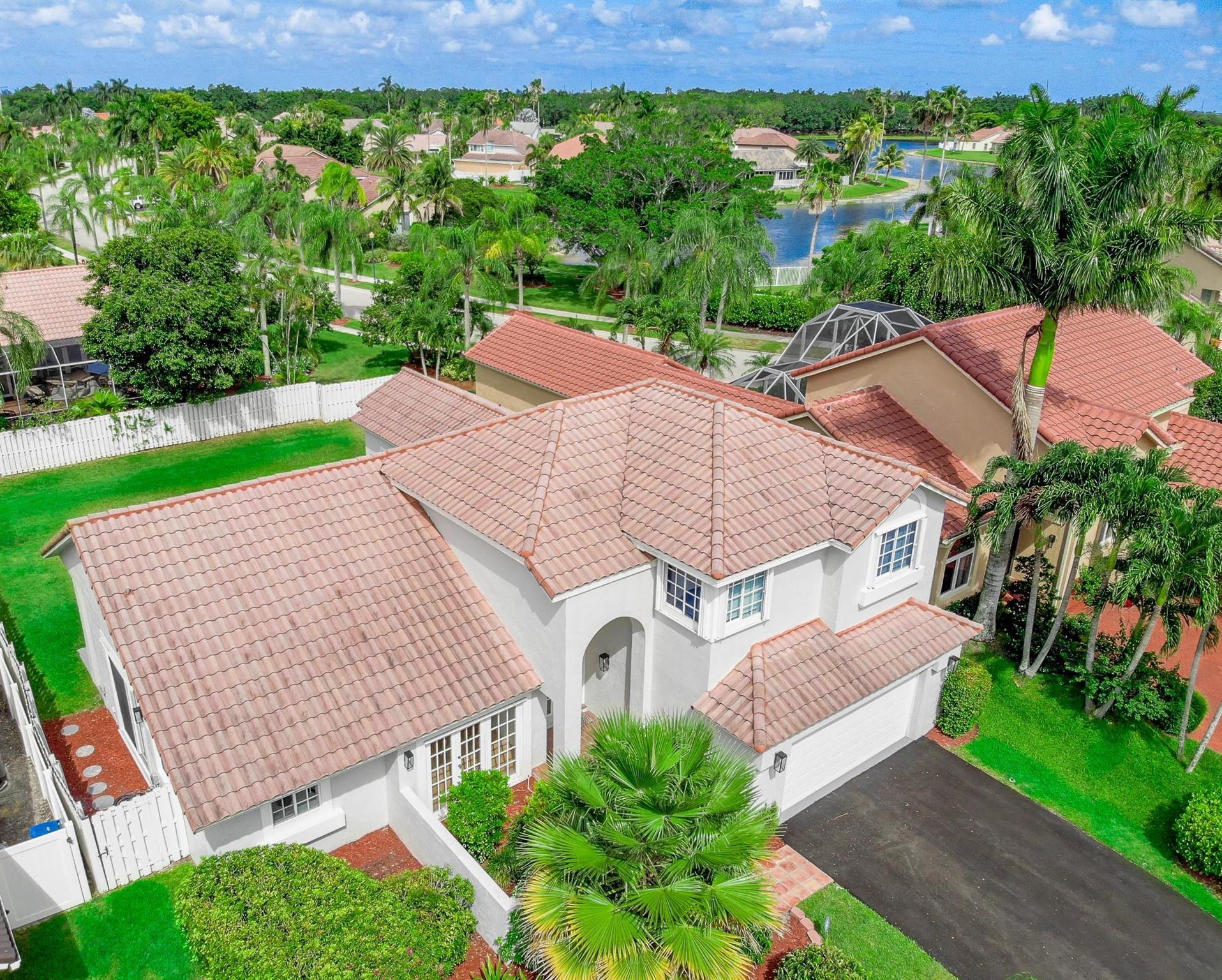 MODEL-PERFECT blend of casual luxury, stunning NEW modern updates & thoughtful functionality in Weston's prettiest neighborhood! Light, bright, airy, meticulous home on almost quarter acre w/private fenced yard w generous covered patio. 1st Floor has primary suite + 5th Bed, ideal as den/nursery; 2nd Floor w private 3BD kids' wing. NEW UPDATES incl modern white quartz kitchen w/high-end stainless appl (Oct 2024), 3 NEW updated bathrooms (July 2025), $25K all NEW permitted plumbing re-pipe (Nov 2024), NEW paint in/out, NEW LED & modern light fixtures, 2024 water heater, new sprinklers & timer, new laundry sink w/high-end W/D. Oversized 2CG w/bike storage, TESLA charger, Trane AC w/Smart thermostat, hurricane accordions + panels. Steps to lakefront clubhouse w pool/spa/ball ct. Top schools!
