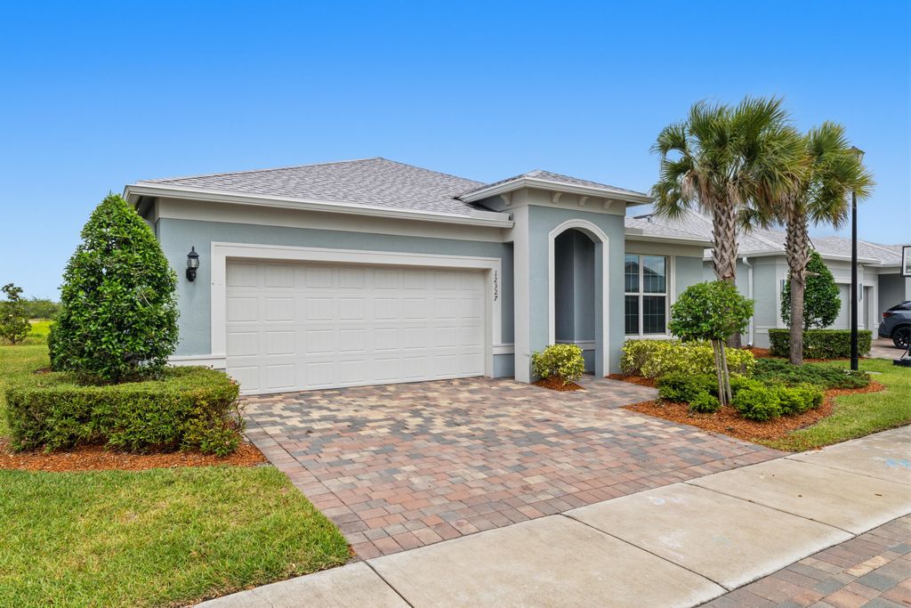 Photo of 12327 SW Sand Dollar Way, Port Saint Lucie, FL 34987 (MLS # B26022209)