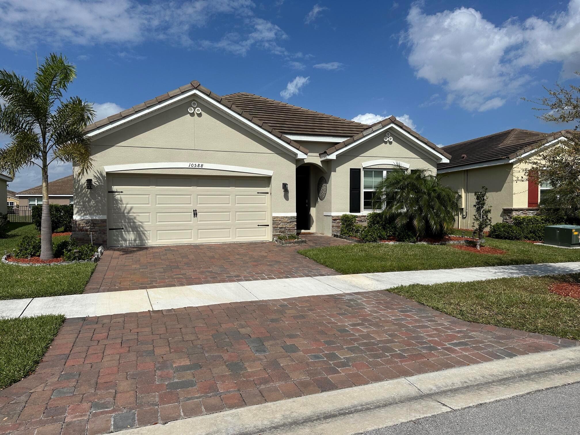 This beautiful and most sought after Cali Model has 4 bedrooms, 2 bathrooms and a 2-Car Garage. A clay tile roof and stone facade accentuates the exterior while the open concept floorplan boasts split bedrooms and a spacious family room that expands to a casual dining area with an open island kitchen. Stainless steel appliances, Smart Home Technology, Brick Paver Driveway, Screened patio. Fully Gated Community includes Community Pool. Lawn Care, cable and internet also included.
