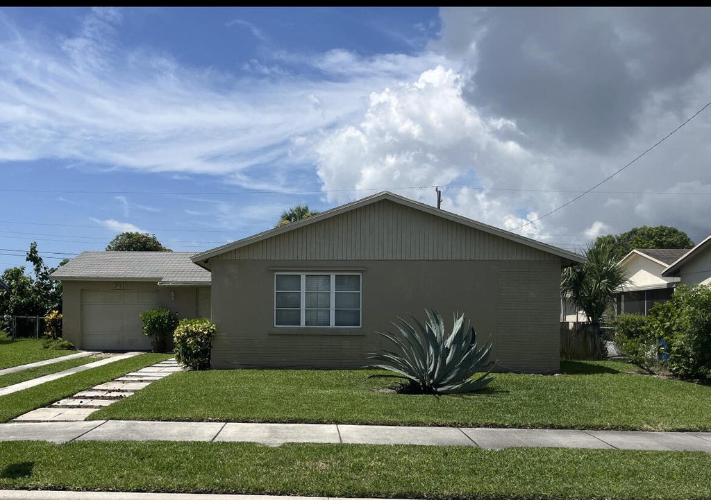 Photo of 1211 W 27TH Street, Riviera Beach, FL 33404 (MLS # B26070231)