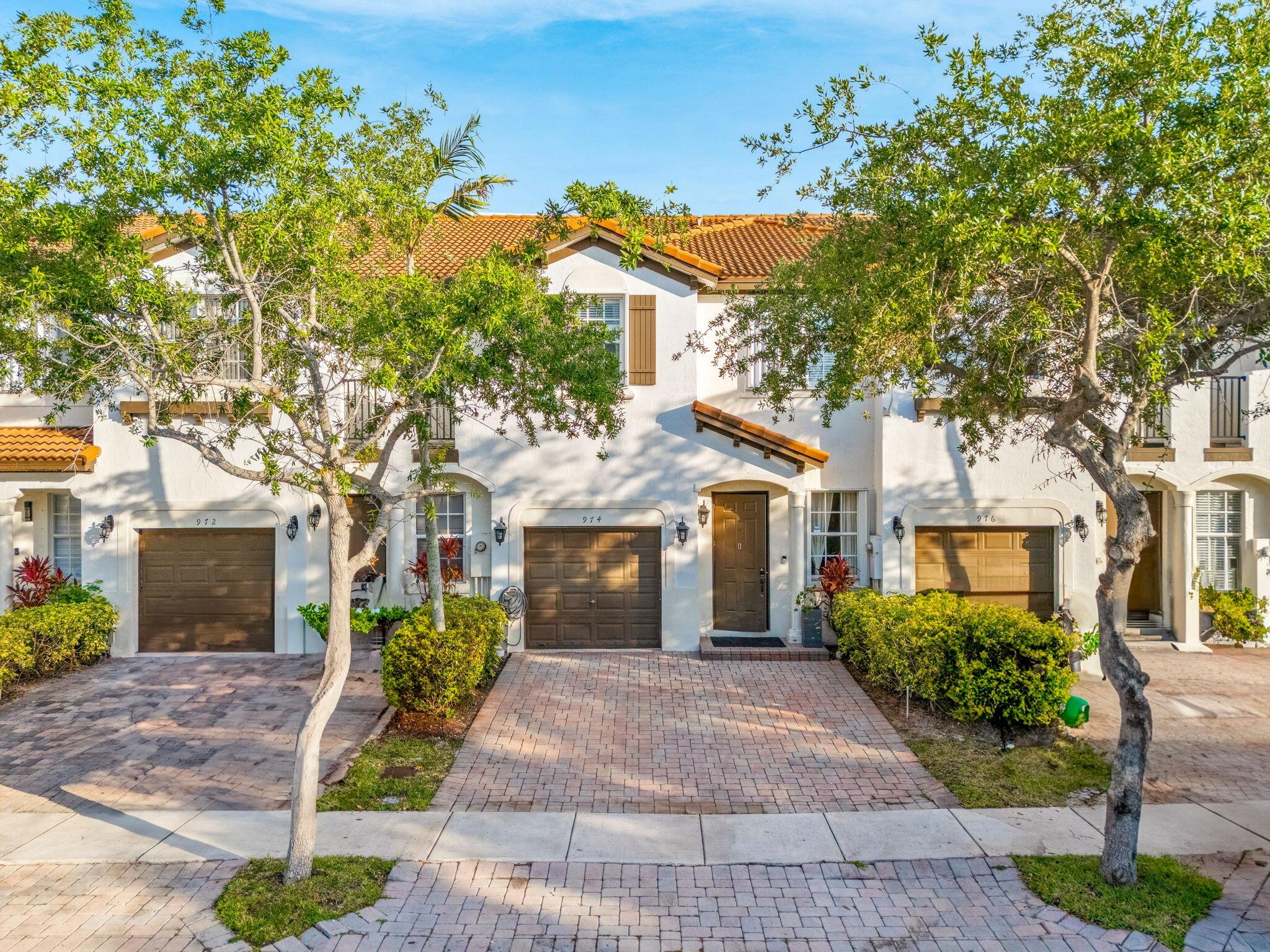 Welcome to 974 NE 29th Terrace in the gated Villas of Portofino East! This updated 3BR, 2.5BA townhome features a renovated kitchen with stainless steel appliances, luxury vinyl plank flooring throughout, and a newer A/C (2019). The spacious primary bedroom can easily be converted back into two separate rooms--ideal for growing households. Enjoy a 1-car garage, accordion shutters, and low HOA fees. Centrally located near shops, schools, and major highways. Seller is motivated--bring your offer! This one won't last!