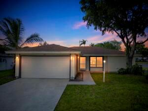 Welcome to this single-family home in the highly desirable gated community of Palm Club Village! This charming 3-bedroom, 2-bath single-family residence boasts a bright and open layout and is ready for immediate occupancy. Outside, enjoy the screened patio area -- ideal for dining al fresco or quiet mornings with your coffee. The two-car garage and driveway provide ample parking and storage. The home is located on a private lot with lush landscaping and is just minutes from I-95, the Turnpike, great schools, and shopping.As part of the Palm Club Village community, your HOA includes manned gate security, lawn/hedge/sprinkler maintenance, basic cable and internet -- giving you peace of mind and carefree living.