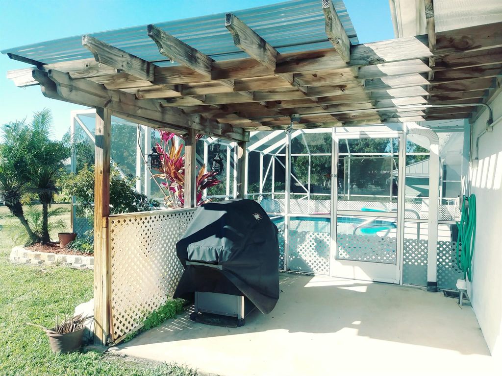 Photo of 980 SE Breakwater Avenue, Port Saint Lucie, FL 34983 (MLS # R11059098)