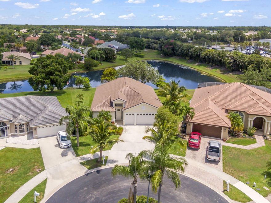 Welcome to this rare lakefront home on a cul-de-sac in the heart of Port Saint Lucie's desirable St Lucie West Community, Heatherwood. Step inside to discover a bright and airy interior featuring open floor plan, vaulted ceilings, tile flooring, and neutral tones throughout. This impeccably maintained home offers an oversized primary bedroom which could be used as a sitting area or office. The expansive primary bathroom is a true retreat with luxurious features including dual vanities, a soaking tub, and separate shower. Enjoy the amazing views of the lake while relaxing in your dining room, living room, or primary bedroom. The 3rd bedroom can be used as a bedroom or den/office, 2.5 baths, and a 2-car epoxy-floor garage with an additional golf cart garage.