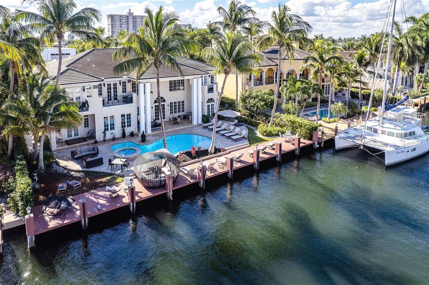 Luxurious Waterfront Living, serene and private on wide canal, in prestigious Seven Isles of Las Olas. This amazing 7 bedroom, 7.5 Bathrooms has a large Entry Foyer & a huge great room with Wet Bar, beautifully appointed soaring ceilings. 2 Master suites, one on each floor, all guestrooms are En-suites. Spacious & well equipped Gourmet kitchen, breakfast area. Formal Dining & a warm, fun, Livingroom. Floor to ceiling windows flood the home with natural light Providing great water views throughout. 3-car garage & an Elevator. Entertainers paradise, outdoor area with covered patio, Built in BBQ. Heated salt pool & spa, multiple outdoor setting areas. 100' deep water dockage on wide canal, for large yacht. Walking distance to restaurants, galleries & worship. Short and long term