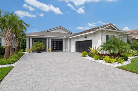 Photo of 10031 Timber Creek Way, Palm Beach Gardens, FL 33412 (MLS # B26080786)