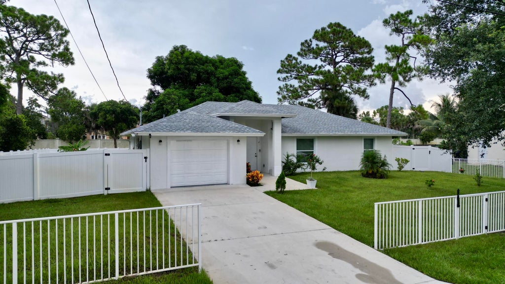Photo of 6539 Alexander Road, West Palm Beach, FL 33413 (MLS # B26063122)