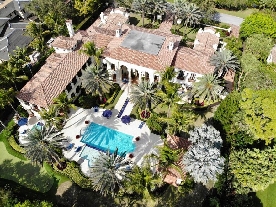 Stunning Turnkey Estate beautifully upgraded in 2022. Winner of the Aurora 2009 Architectural National Award, ASLA 2009 Landscape Honor Award, 2009 Excellence in Interior Design Award, and was also featured on the cover of Florida Design as one of their homes of the year in 2009. Spectacular opportunity to own this exceptional 6BR/8.3BA Mediterranean home located in the serene Bear's Club community, originally built in 2009. With 16,360 +/- living square feet, gorgeous flooring, stunning ceiling details, and beautiful finishes throughout, the home exemplifies the highest standards of quality and attention to detail. Interior features include grand living room with double height ceilings, family room with bar and fireplace, and romantic spiral staircase leading to second story loft and galleria. Expansive first floor Owner's Suite with dual baths and walk-in closets, library with fireplace, and private patio. Gourmet kitchen with top of the line appliances, butler's pantry, and charming morning room. Phenomenal outdoor spaces perfect for entertaining, with columned loggias, multiple covered and open balconies with gorgeous golf course views, pool front gazebo with fireplace, and summer kitchen with built-in grill. Additional highlights include oversized pool with sun shelf and fountains, spa, and putting green designed by Jack Nicklaus.