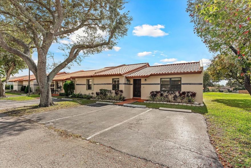 Spectacular 2-bedroom, 2-bath corner villa in the rarely available Forest Lake community of Cooper City. This light-filled home features impact windows and doors, elegant finishes, stylish fixtures, and plantation shutters throughout. The beautiful kitchen offers wood cabinetry, granite countertops, stainless steel appliances, and a newer dishwasher. Vaulted ceilings and recessed lighting enhance the open, bright layout. The spacious primary suite includes a large walk-in closet and a beautifully appointed en-suite bath. Enjoy outdoor living in the private gated patio perfect for entertaining family and friends. Upgrades include a newer washer and dryer and a 2023 tankless water heater. Pet-friendly community with lush green spaces and park areas. Cooper City has excellent A-rated schools.