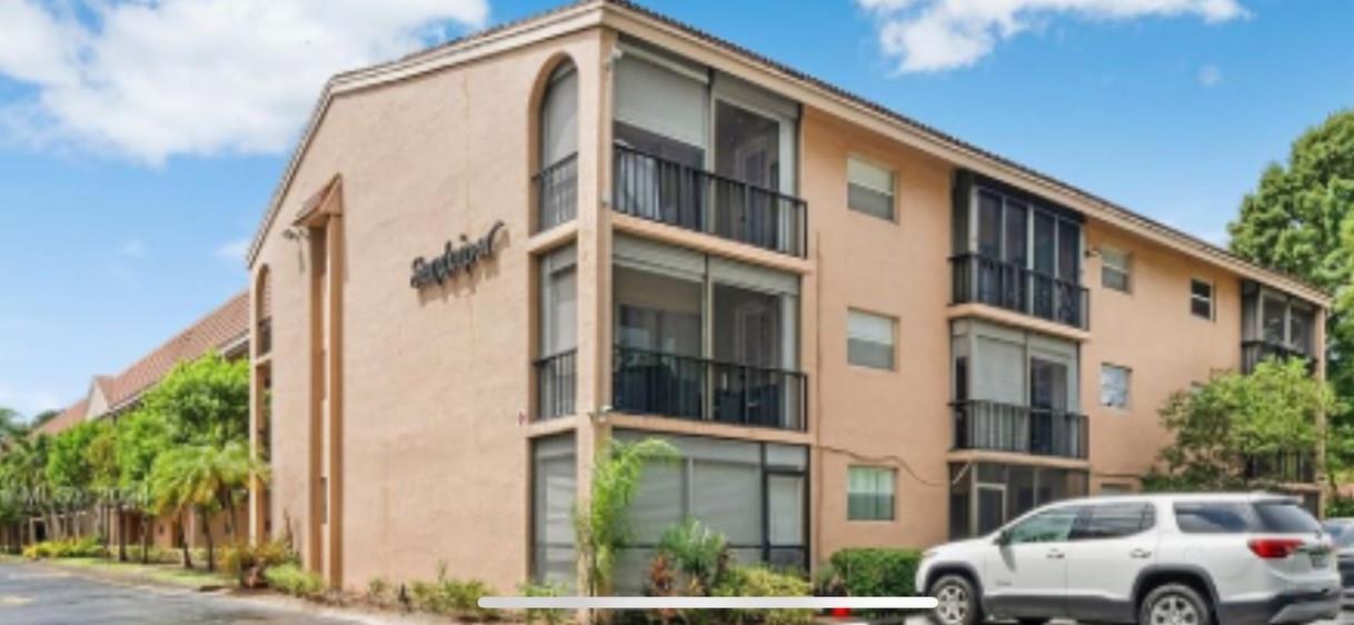 Check out this spacious 2 bed, 2 bath in the heart of Coral Springs. Excellent location for families of all ages. Directly across from the Fire and Police Departments. Coral Springs Center for the Arts, Museum, and Parks complex are located close by. Easy access to Coral Springs Hospital and restaurants within close vicinity. Great schools within the zone. The property is well maintained. NEW roof 2023, NEW elevator 2023, Parking lot re-paved 2023. Pool and open back courtyard. Designated car space with additional parking. The unit is sheltered from the elements as a middle unit with storm shutters. Quiet with no overhead neighbors. Large master bedroom w/door to balcony. Ample closet space throughout. Washer/Dryer in unit. Open kitchen looking out into dining and living space. Rentspree