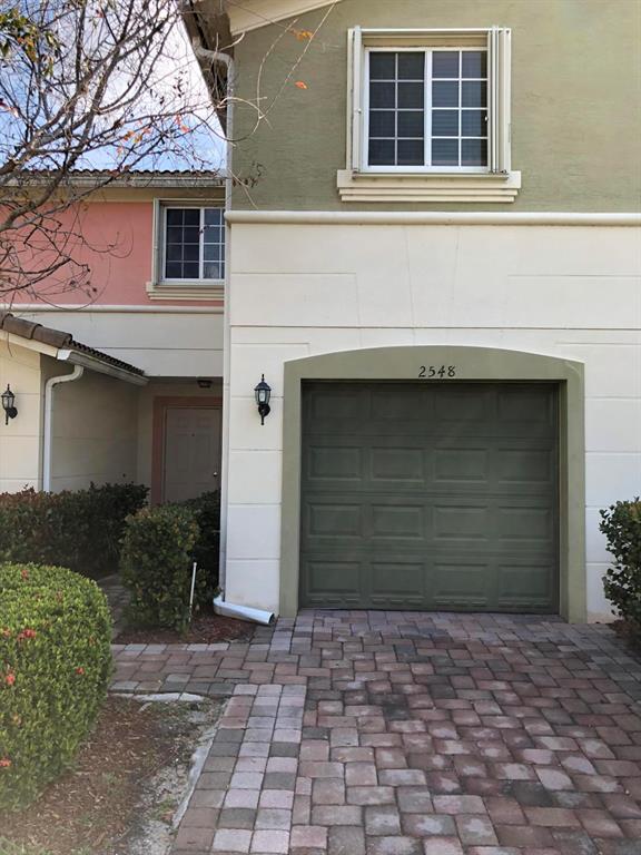 Charming 3 bedroom townhome on long lake in Newport Isles. Immaculate with brand NEW carpet in 3 bedrooms. 16 SEER A/C. 4 Ceiling fans throughout. 2 full baths upstairs and a half bath downstairs. ACCORDION SHUTTERS UPSTAIRS. Laundry area with washer and dryer. Downstairs is open and airy with tile throughout and a view of the lake. Kitchen has granite counters, refrigerator, stove, microwave and dishwasher. NEW PAINT INSIDE. One car garage. Minutes to I-95. Close to Tradition, Publix, Walmart, Sam's, Bravo, Martin Medical Center and many restaurants. Community has 3 pools, clubhouse, basketball & tennis courts. Guard gated subdivision. HOA fee includes Internet, guard gate, lawn maintenance, common areas, and painting of exterior of townhomes.