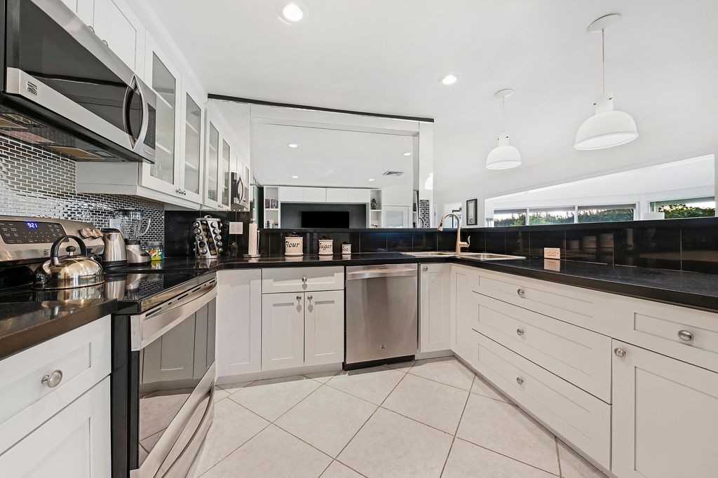 Photo of 314 Cedar Key Circle, Atlantis, FL 33462 (MLS # R11014126)