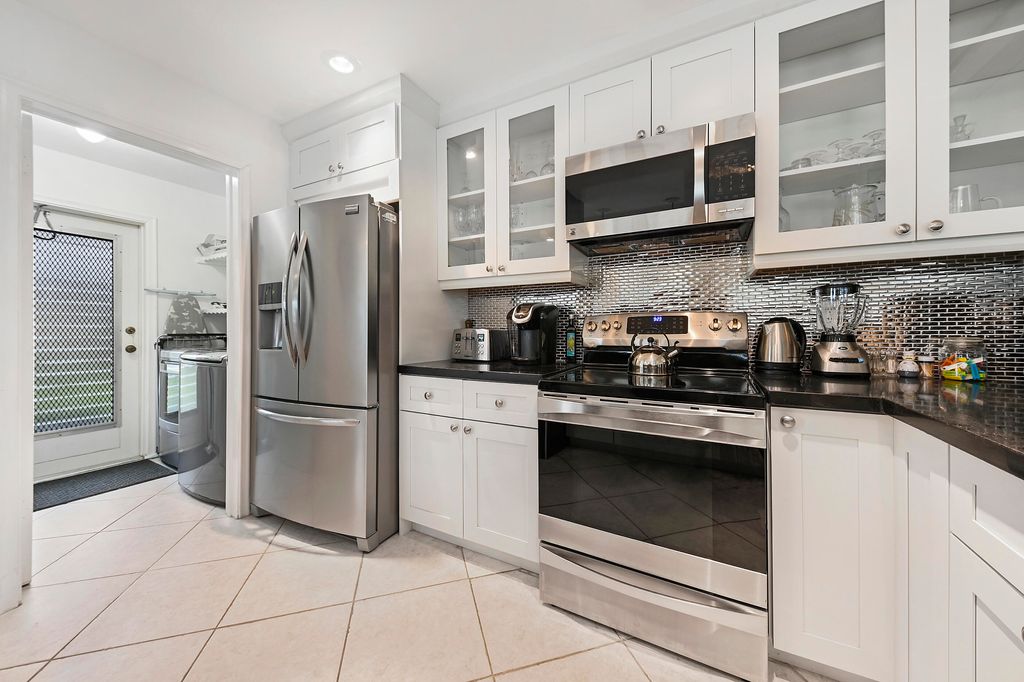 Photo of 314 Cedar Key Circle, Atlantis, FL 33462 (MLS # R11014126)