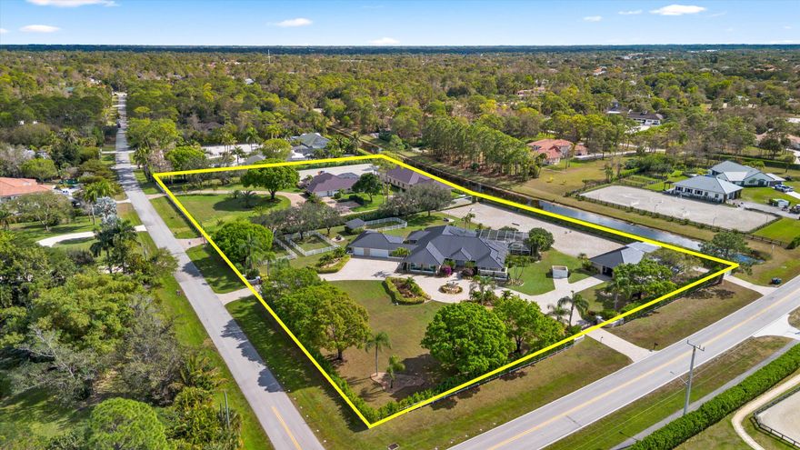 A rare opportunity to own the ultimate equestrian estate on 4.74 acres across two combined parcels. This exceptional property features two residences—a 4-bedroom, 3-bath home and a 3-bedroom, 3-bath home—both offering open floor plans ideal for modern living. Designed for serious equestrians, the estate includes a 12-stall barn, two arenas, a dressage mirror, and six paddocks. Outdoor living shines with two pools and a summer kitchen, perfect for relaxing or entertaining. An extraordinary compound blending luxury, functionality, and top-tier equestrian amenities.