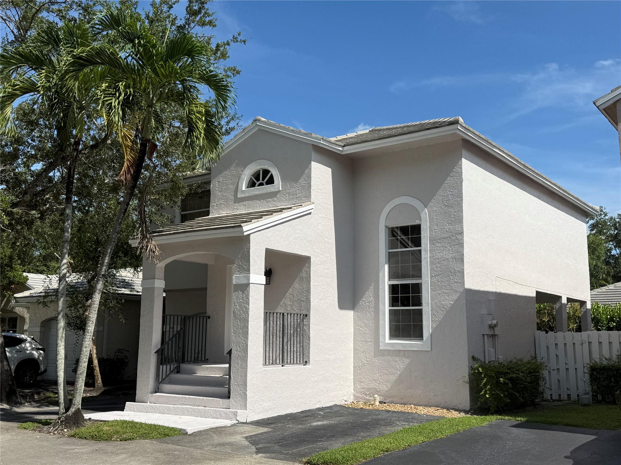 Charming 3/2.5 single family home in a beautiful quiet Plantation neighborhood. The first floor is spacious w/ tile throughout and plenty of natural light with a 1/2 bath off the kitchen. Upstairs, there are three large rooms. The primary suite has an expansive walk-in closet. Plenty of parking w/ a one-car garage and an extra parking pad. Outside, there is a covered patio and a fenced-in yard for your pet, entertaining, or simply enjoying the peaceful surroundings. The low HOA fee maintains the community pool/playground, and yard. This home is ready for a new owner to make it their own and priced accordingly. Roof replaced in 2011, A/C was replaced in 2017, Exterior freshly painted. Excellent location, close to recreational parks, shopping and schools.