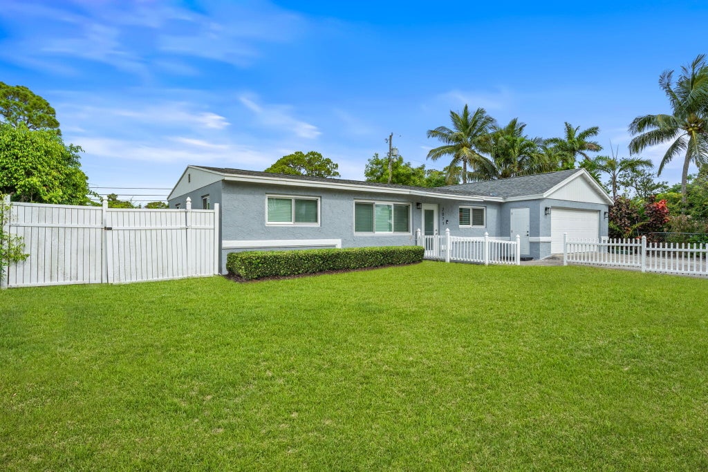 Photo of 2071 W Carol Circle, West Palm Beach, FL 33415 (MLS # B26074193)