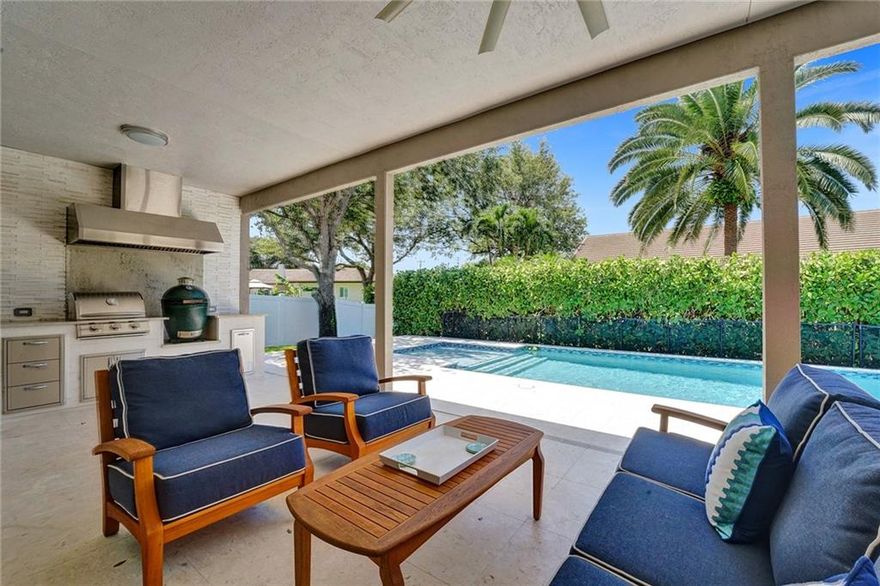 Come enjoy high-end finishes in this classic 4-bedroom, 3-bathroom one-story rancher in Davie Country Estates. Cross the threshold into an impressive entryway, plantation shutters throughout, and a gas fireplace in the living room. Fresh updates, two built-in ovens, and an attractive island layout make for an inspiring kitchen. The primary bedroom includes two walk-in closets and an ensuite bath. In this split floor plan, two bedrooms have large walk-in closets, and the fourth bedroom is currently an office. The piece de resistance is the backyard which boasts a heated pool with a hot tub, a beautiful outdoor kitchen with a built-in gas grill, and a charcoal egg. This home is a safe haven during storms with plumbed gas, impact windows, an impact garage door, and a new roof (2020). Attached HOA docs - Bylaws & Covenants