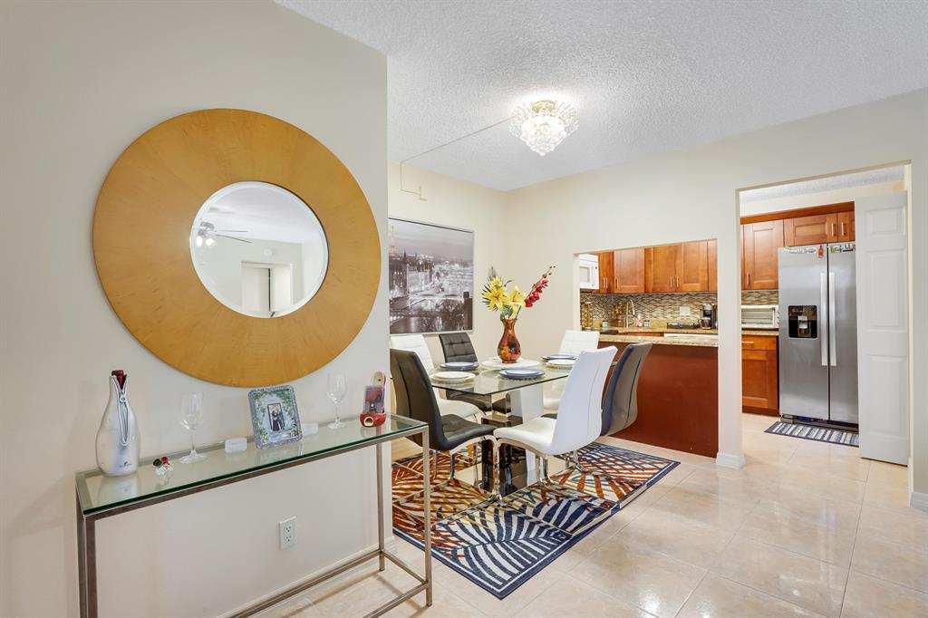 Newly renovated, owner occupied, 2 bedroom 2 full bathroom condo in a gated community. The entrance is equipped with a ring camera that is linked to your phone and functions both as a doorbell and security camera. The patio is newly painted and fully screened in with a metal covering at the bottom to keep out outside debris and built in blinds for privacy and cooling on a hot summer day. It also has two outlets to plug in a fan and additional light fixture. There is an outside storage unit with built-in shelves and light. The entire unit from the outside is equipped with easy to close accordion hurricane shutters.