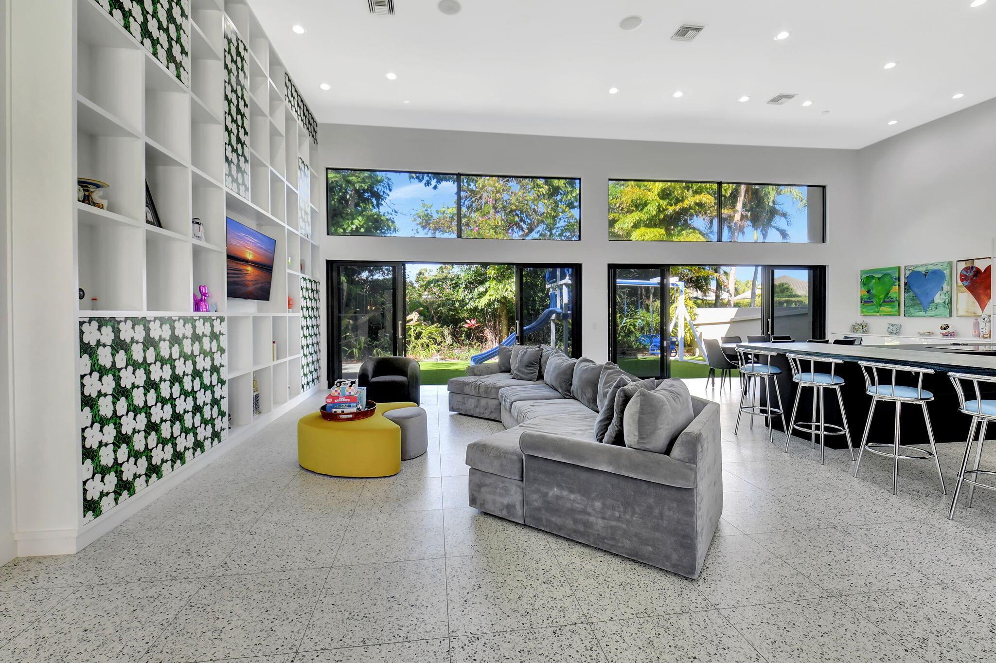 Experience luxury living at its finest in this elegant & meticulously renovated 6 bedroom, 6 bath modern courtyard estate, located in the prestigious Vintage Place subdivision of Broken Sound. Boasting 4,412 sq ft under air, this home features soaring ceilings, an open-concept floor plan, chefs dream kitchen, large center island, custom cabinetry & high end appliances. The spacious primary suite is conveniently located on the main level. The centerpiece of this home is the courtyard, a serene outdoor haven for relaxation & play complete with a splash pool, covered barbecue area, sleek modern astroturf, and guest house for family & friends. World-class amenities, including golf, tennis, pickleball, spa, dining, and a state-of-the-art fitness center make this home one not to miss!